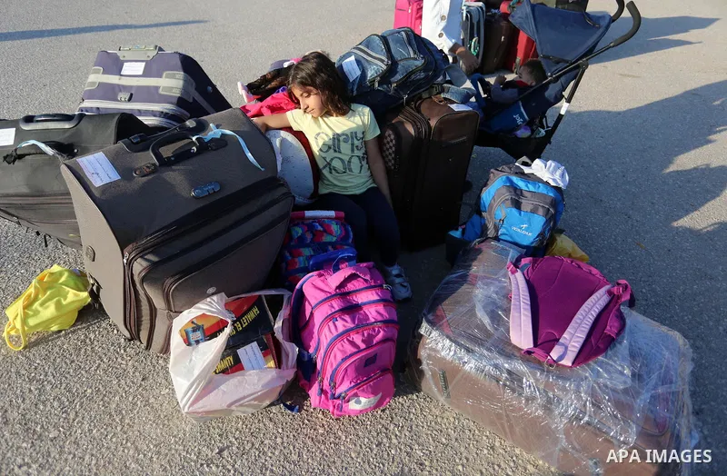 Palestinians wait for travel permits to cross into Egypt through the Rafah border crossing in Rafah in the southern of Gaza Strip, on August 11, 2020. For the first time in five months, Egypt on Tuesday reopened Rafah cr...