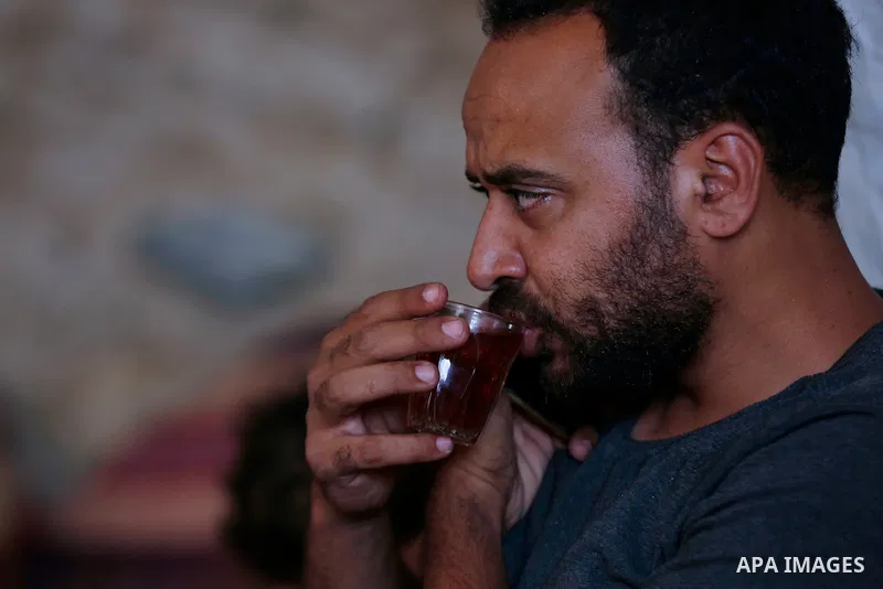 Palestinian Ahmed Amarneh, drinks tea in his home which he built in cave, in the village of Farasin, west of Jenin, in the northern West Bank on August 11, 2020. Amarneh, a 30 year old civil engineer, lives with his fami...