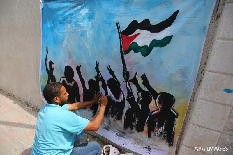 Palestinian youths take part in the open day on the International Youth Day, in front of the High Commissioner for Human Rights office, in Gaza on August 12, 2020. Photo by Ashraf Amra