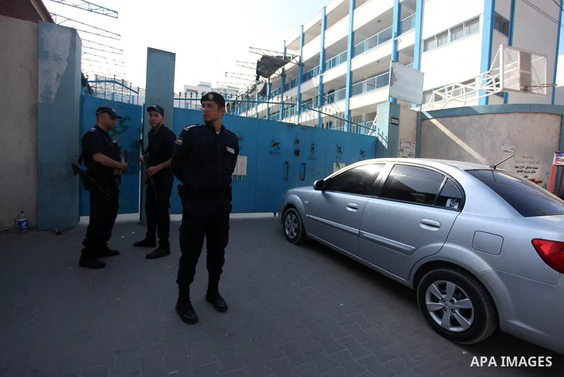 Palestinian policemen inspect the damage after an explosion at a United Nations-run school in Gaza City, on August 13, 2020. An unexploded missile fired by an Israeli warplane was discovered this morning in an elementary...