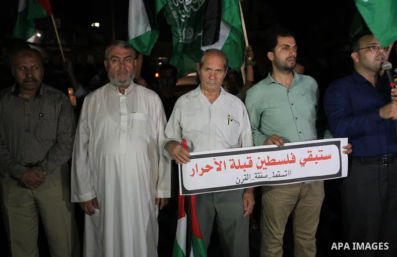 Palestinian supporters of the Hamas movement, take part in a protest against the United Arab Emirates' deal with Israel to normalise relations, in Gaza city, on August 15, 2020, against a US-brokered deal between Israel...