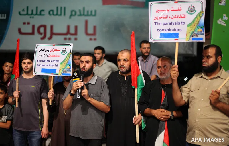 Palestinians take part in a protest against the United Arab Emirates' deal with Israel to normalise relations, in Gaza city, on August 15, 2020, against a US-brokered deal between Israel and the UAE to normalise relation...
