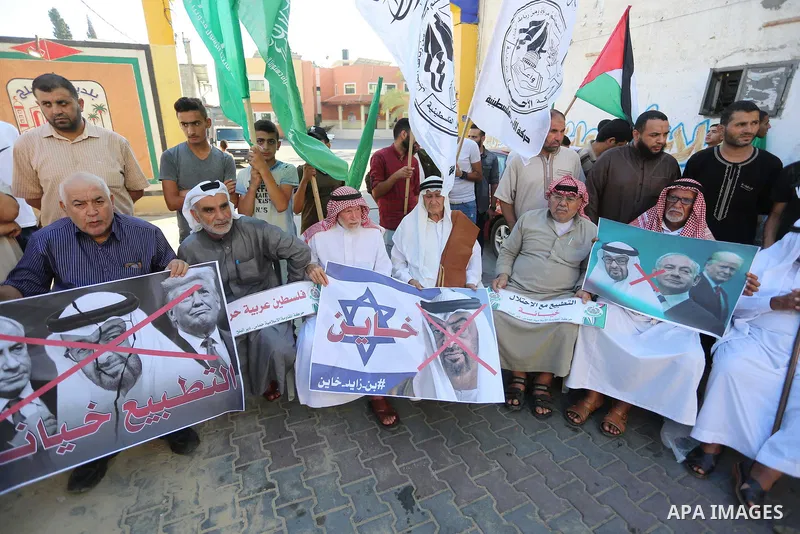 Palestinians take part in a protest against the United Arab Emirates' deal with Israel to normalise relations, in Dair Al Balah in the central of Gaza Strip, on August 16, 2020, against a US-brokered deal between Israel...