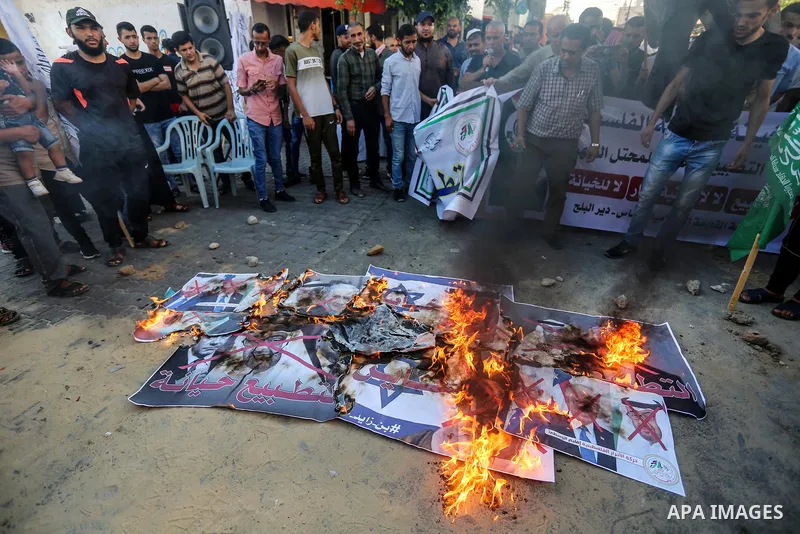 Palestinians take part in a protest against the United Arab Emirates' deal with Israel to normalise relations, in Dair Al Balah in the central of Gaza Strip, on August 16, 2020, against a US-brokered deal between Israel...