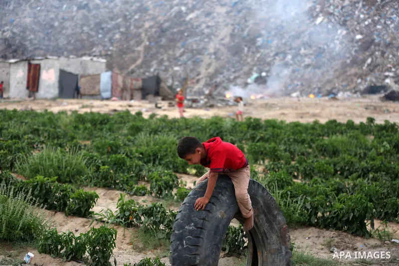 Palestinian children play near their house in Khan Yunis in the southern Gaza Strip, on August 18, 2020. A Palestinian official in the Gaza Electricity Distribution Company announced on Tuesday that the only power statio...
