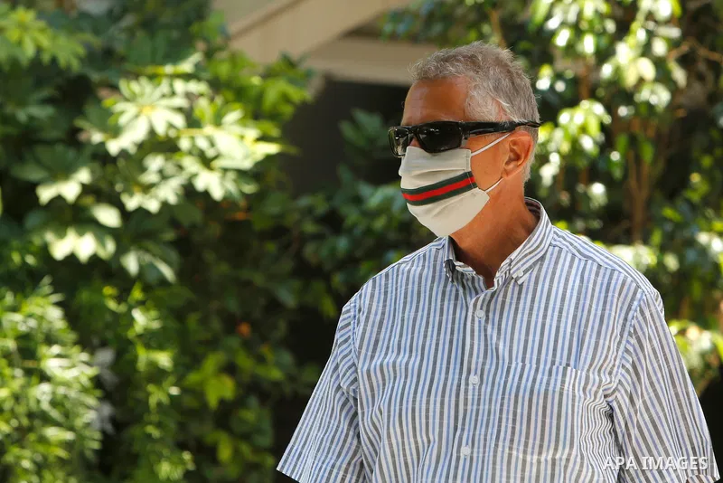 Lebanese wearing a mask as a means of protection against the coronavirus, walks on a street as Lebanon imposed a partial lockdown for two weeks starting on Friday in an effort to counter the spread of the coronavirus dis...