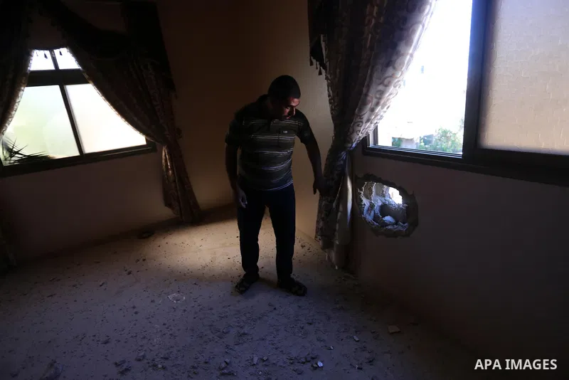 Palestinians inspect damage a house that was hit by an Israeli artillery shell this morning in eastern Khan Yunis in the southern Gaza Strip on August 24, 2020. Israel has bombed the coastal Gaza strip almost daily since...
