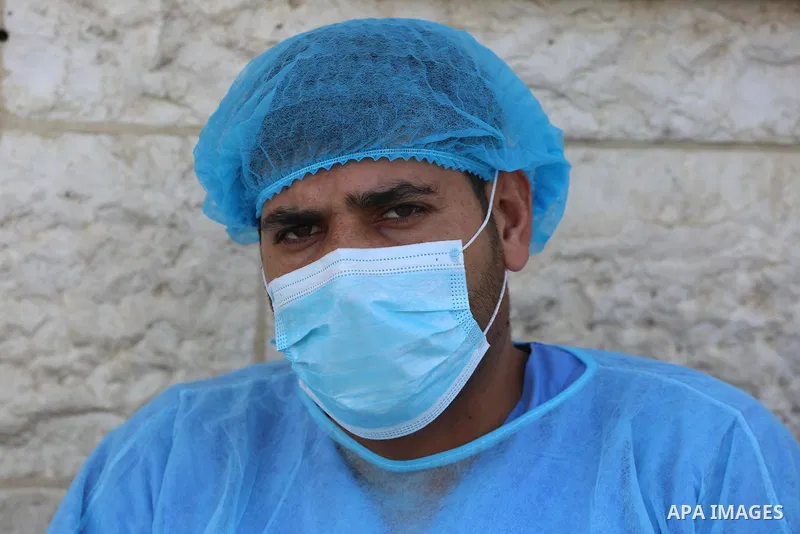 Palestinian workers wear face masks during their work during the imposed lockdown to mitigate virus outbreak in the Gaza Strip, in Dair Al Balah in the central of Gaza Strip on August 27, 2020, during a lockdown in the P...