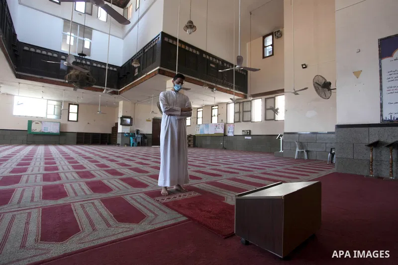 Palestinian imam of the mosque prays at a mosque is empty of worshipers, during the imposed lockdown to mitigate virus outbreak in the Gaza Strip, in Gaza city on August 28, 2020, during a lockdown in the Palestinian enc...