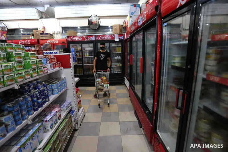 Palestinians wear protective face masks, as they shop during a lockdown following the outbreak of the coronavirus disease (COVID-19), at a market, in Dair Al Balah in the central of Gaza Strip, on September 6, 2020. Phot...
