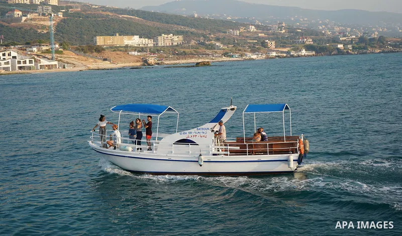Lebanese enjoy at the beach of Batroun, North Lebanon on September 6, 2020. Photo by Mohammed Othman