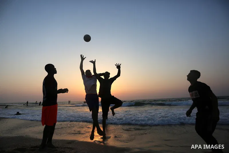 Palestinians enjoy at the beach, amid the coronavirus disease (COVID-19) outbreak, in Dair Al Balah in the central of Gaza Strip on September 11, 2020. Photo by Ashraf Amra
