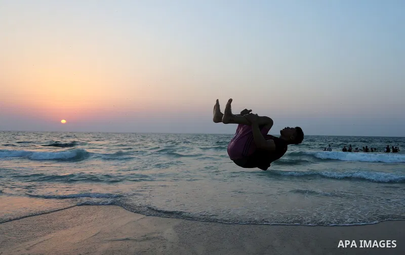 Palestinians enjoy at the beach, amid the coronavirus disease (COVID-19) outbreak, in Dair Al Balah in the central of Gaza Strip on September 11, 2020. Photo by Ashraf Amra