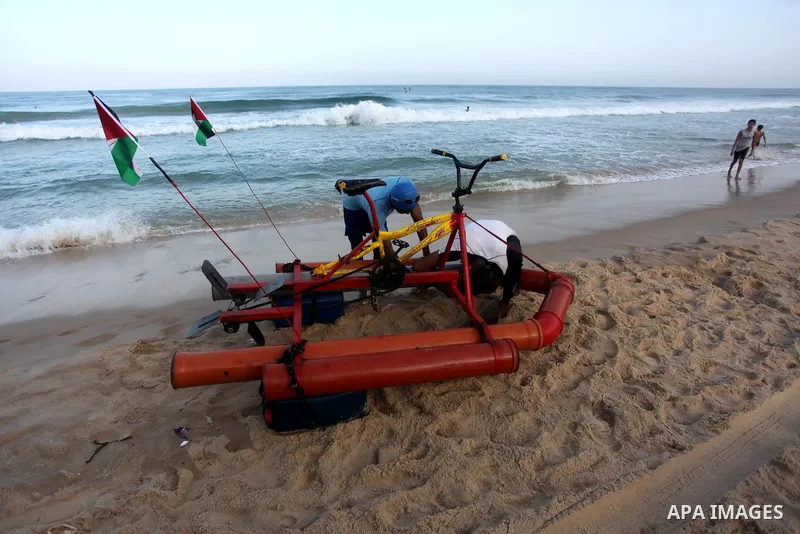 Palestinian youth prepare a water bike before driving it in the Mediterranean Sea beach, in Beit Lahia in the northern of Gaza Strip, on September 29, 2020. Palestinian youth invented a water bike from simple tools.. Pho...