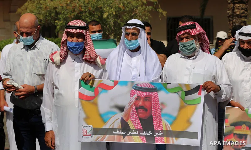 Members of the Palestine Scholars Association and the municipality of Deir Al-Balah, take part in a stand of support with the Kuwaiti people after the death of emir Sheikh Sabah al-Ahmad Al-Sabah, in Deir al-Balah in the...