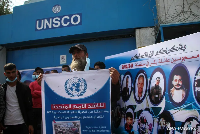 Palestinians hold pictures of their missing relatives during a protest, in front of the headquarter United Nation "UNSCO" in Gaza city, on November 8, 2020. Gazans are missing after one of the deadliest migrant shipwreck...