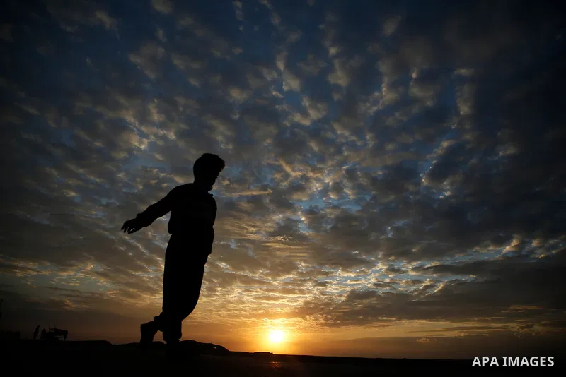 Palestinians enjoy the beach along the shore of the Mediterranean Sea during the sunset in Gaza city, on November 4, 2020. Photo by Osama Baba