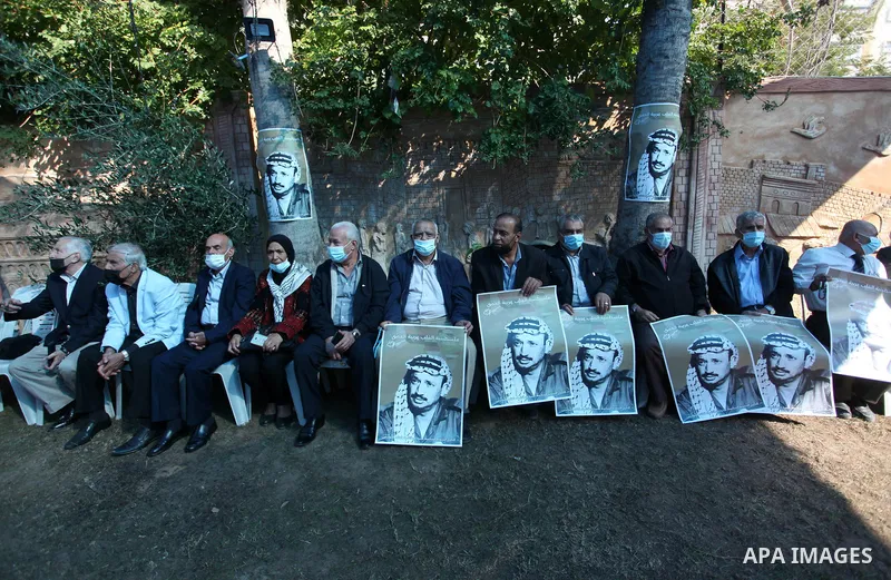 Palestinian leaders commemorate the 16th anniversary of the death of late Palestinian leader Yasser Arafat, at his home in Gaza City on November 11, 2020. Photo by Mahmoud Ajjour