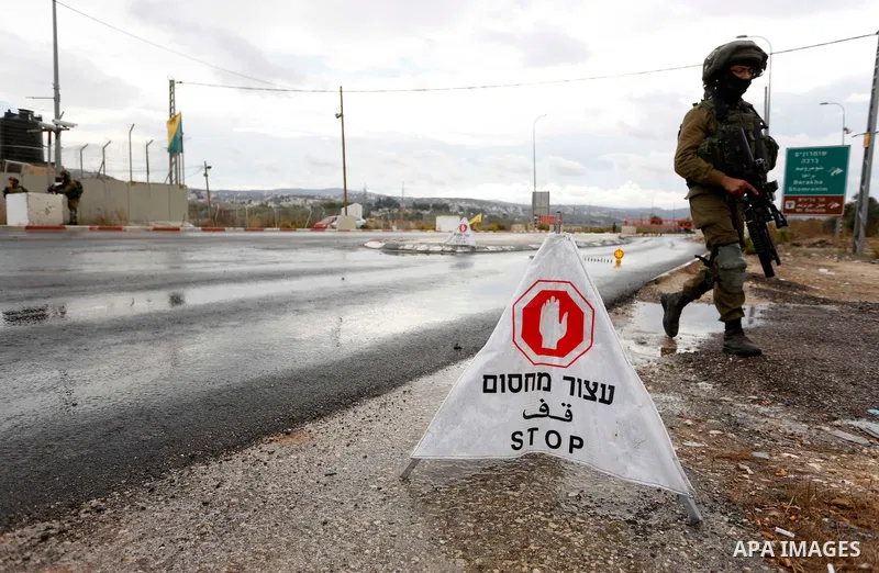 Israeli soldiers gather at a checkpoint near Nablus in the occupied West Bank where a Palestinian who shot at Israeli troops on November 4, 2020 was killed when soldiers returned fire, Israel's army said. Photo by Shadi...