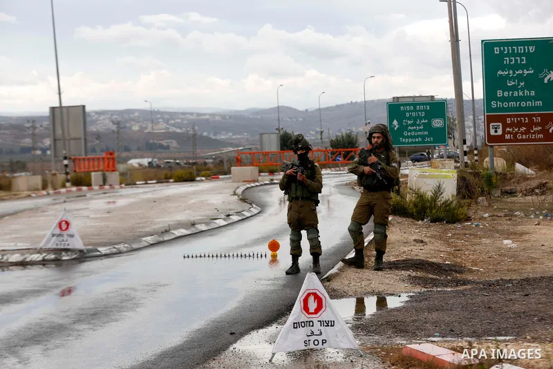 Israeli soldiers gather at a checkpoint near Nablus in the occupied West Bank where a Palestinian who shot at Israeli troops on November 4, 2020 was killed when soldiers returned fire, Israel's army said. Photo by Shadi...