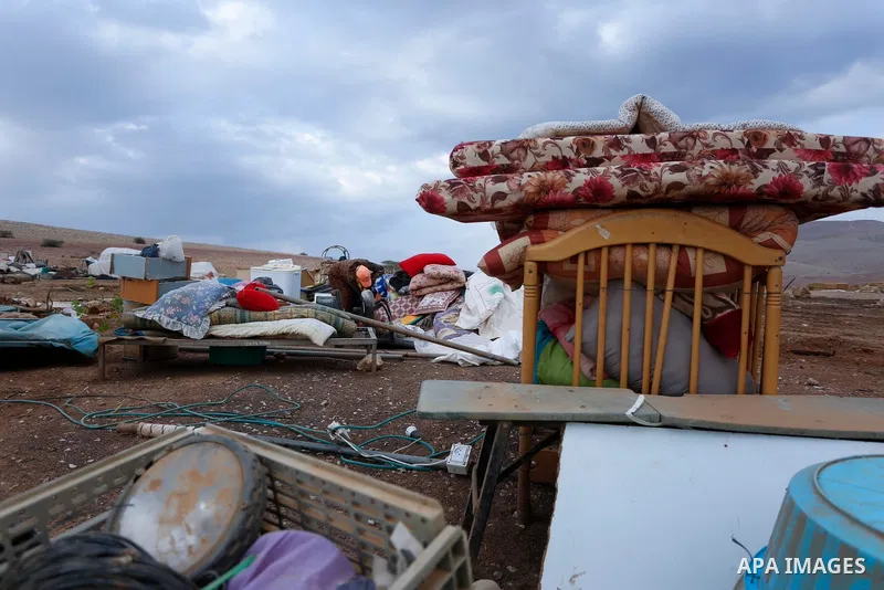 Palestinian bedouins stand next to their belongings after Israeli soldiers demolished their tents in an area east of the village of Tubas, in the West Bank, on November 3, 2020. Photo by Shadi Jarar'ah