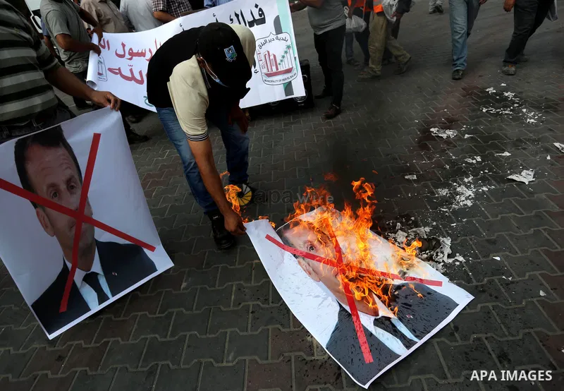 Palestinians take part in a protest against the French incitement against the Islamic religion and the Holy Prophet Muhammad, in Dair Al Balah in the central of Gaza Strip on October 31, 2020. Photo by Ashraf Amra