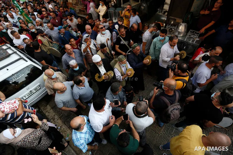 Palestinian Muslims commemorate the birth anniversary of Islam's prophet Mohammed, in the West Bank city of Nablus on October 29, 2020. Photo by Shadi Jarar'ah