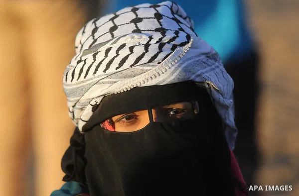 Palestinian protesters gather during clashes with Israeli troops in tents protest where Palestinian demand the right to return to their homeland at the Israel-Gaza border, in Khan Younis, in the southern Gaza Strip on Ju...