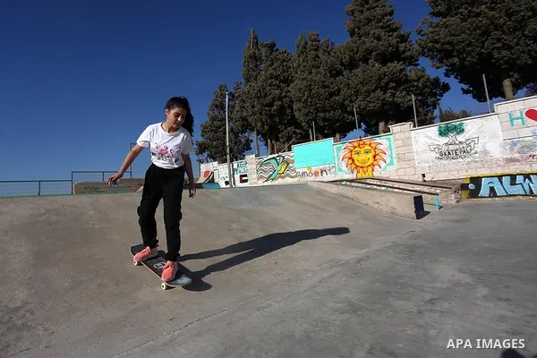 A Palestinian girl skateboards in a skatepark in the village of Asira ash-Shamaliya, near the West Bank city of Nablus, July 02, 2019. Skateboarding is an action sport which involves riding and performing tricks using a...