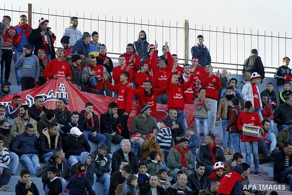 Fans attend the crucial AFC Champions League Playoff phase football match between Palestinian's Ahly Al-Khalil football team and FC Khujand team at Dura Stadium in the West Bank city of Hebron on Feb. 09, 2016. Mahmoud W...