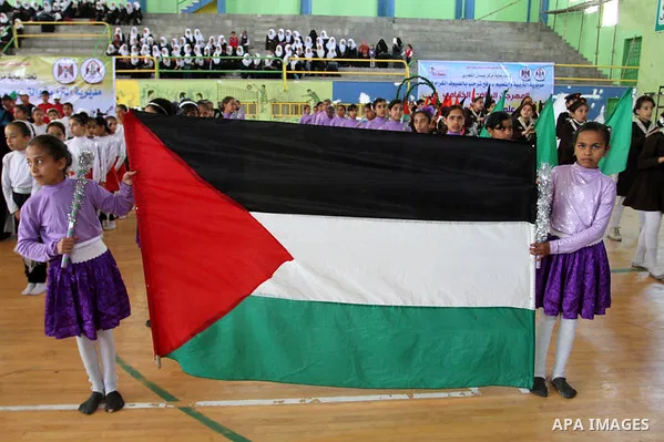 Palestinian students demonstrate their skills during the sports festival organised by the ministry of education in Rafah in the southern Gaza Strip, April 6, 2015. Photo by Abed Rahim Khatib