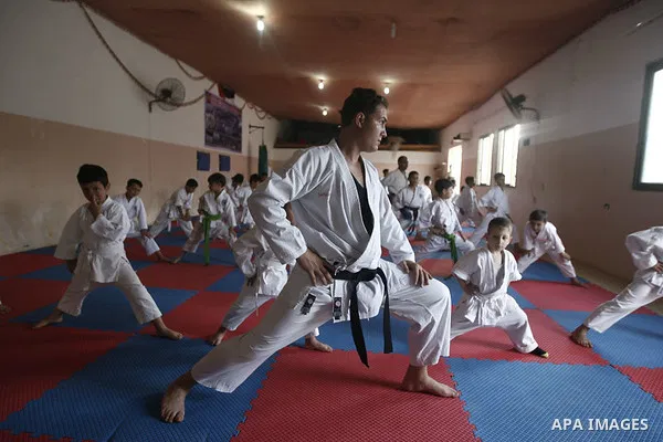 Palestinian boys take part in a karate class, which aims at teaching self-defense techniques during the summer holidays, at sport club in Gaza City on June 29, 2013. Photo by Emad Nassar