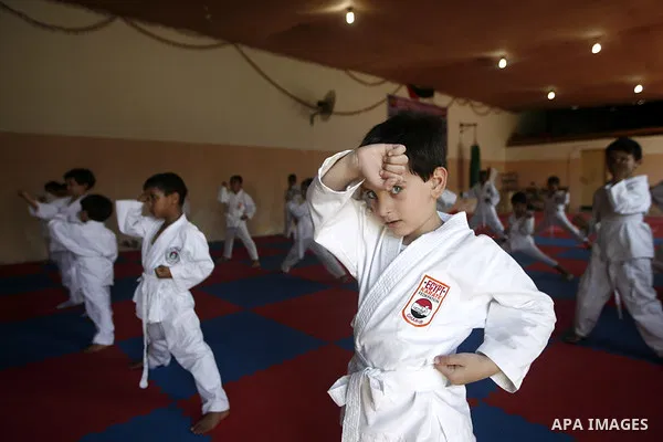 Palestinian boys take part in a karate class, which aims at teaching self-defense techniques during the summer holidays, at sport club in Gaza City on June 29, 2013. Photo by Emad Nassar