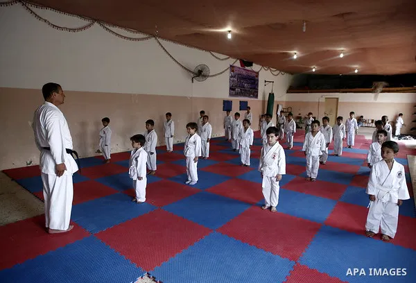 Palestinian boys take part in a karate class, which aims at teaching self-defense techniques during the summer holidays, at sport club in Gaza City on June 29, 2013. Photo by Emad Nassar
