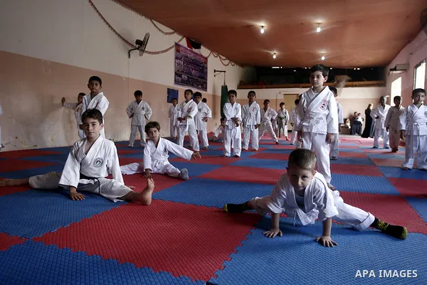 Palestinian boys take part in a karate class, which aims at teaching self-defense techniques during the summer holidays, at sport club in Gaza City on June 29, 2013. Photo by Emad Nassar