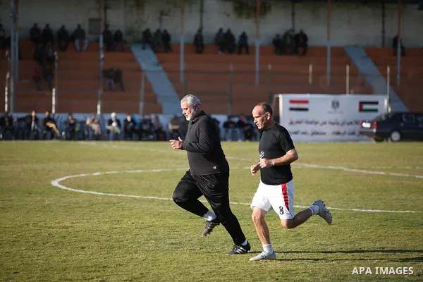 Palestinian Prime Minister in Gaza strip Ismail Haniyeh plays football with the Egyptian sport delegation, in Gaza city on 13 January 2013. The Egyptian minister of sports, Al-Ameri Farouk, arrived in Gaza on Saturday ev...