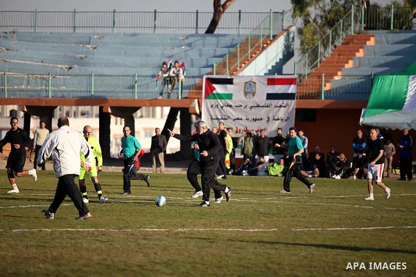 Palestinian Prime Minister in Gaza strip Ismail Haniyeh plays football with the Egyptian sport delegation, in Gaza city on 13 January 2013. The Egyptian minister of sports, Al-Ameri Farouk, arrived in Gaza on Saturday ev...