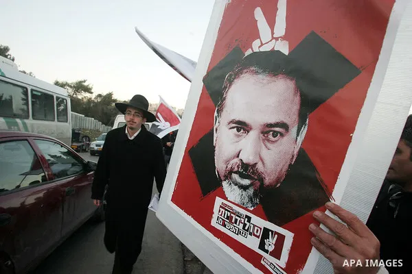 Demonstrators protest across the street from what remains of the Shepherd Hotel in the Sheikh Jarrah neighborhood in East Jerusalem during a protest against Jewish settlement of Arab East Jerusalem following the building...