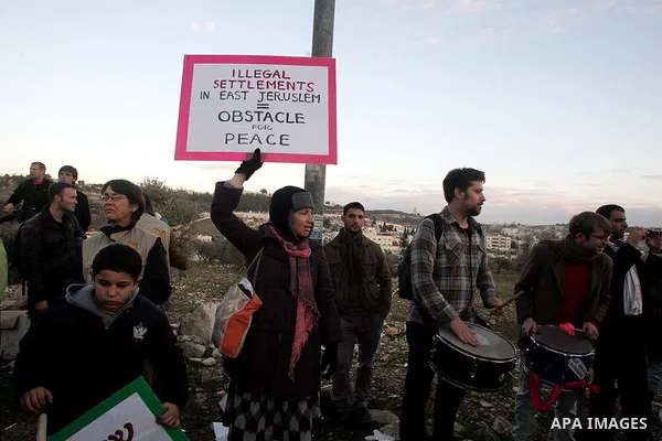 Demonstrators protest across the street from what remains of the Shepherd Hotel in the Sheikh Jarrah neighborhood in East Jerusalem during a protest against Jewish settlement of Arab East Jerusalem following the building...