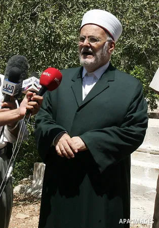 Palestinians show the destruction in the graves in the city of Jerusalem on August 6,2010. New plan for the Jerusalem municipality to remove the cemetery of Mamun Allah in West Jerusalem as the graves that marked in red,...