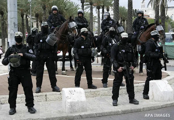 Israeli soldiers stand guards outside the Al-Aqsa Mosque pray during Friday prayers outside Jerusalem's Old City, Friday, March 19, 2010. Palestinians in east Jerusalem and the West Bank lobbed rocks at Israeli security...
