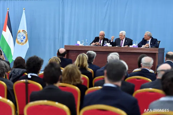 Palestinian President Mahmoud Abbas addresses during a meeting with a J Street delegation and members of the Democratic Party of the US Congress at the presidential headquarters, in the West Bank city of Ramallah, Februa...