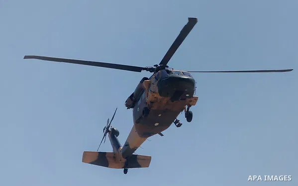 A military helicopter carried Chairman of the Tripartite Presidency of Bosnia and Herzegovina Bakir Izetbegovic is seen on the sky of the West Bank city of Ramallah, before his meeting with Palestinian President Mahmoud...