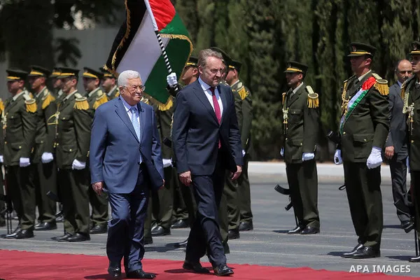 Palestinian President Mahmoud Abbas and Chairman of the Tripartite Presidency of Bosnia and Herzegovina Bakir Izetbegovic review the honor guard during a reception ceremony, in the West Bank city of Ramallah on August 29...