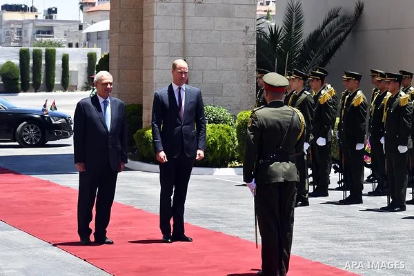 Britain's Prince William reviews the honor guard during a reception ceremony in the West Bank city of Ramallah, on June 27, 2018. Photo by Thaer Ganaim