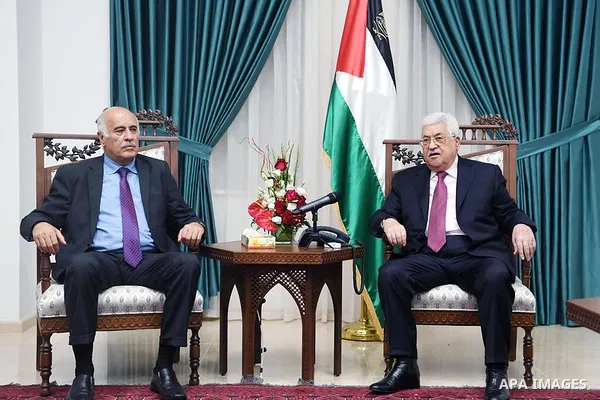 Palestinian President Mahmoud Abbas meets with Jibril Rajoub, the head of the Palestinian Football Association, in the West Bank city of Ramallah on June 7, 2018. Photo by Thaer Ganaim