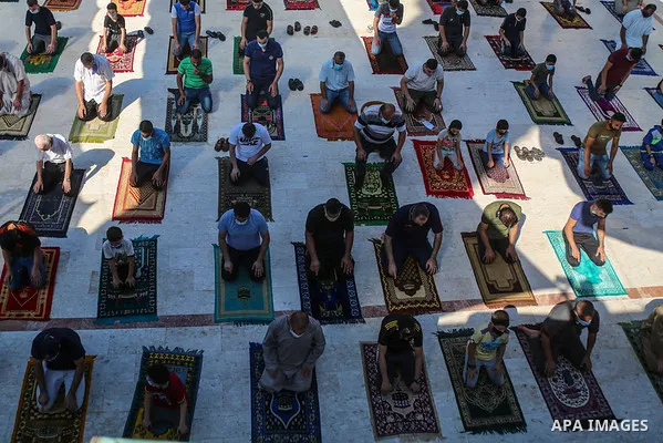 Palestinians wear face masks as a precaution due to the COVID-19 coronavirus pandemic, pray in a mosque as the holy places reopen to worshippers to perform the weekly Islamic ritual, in Gaza City, on October, 23, 2020. P...