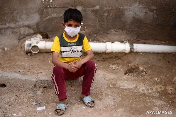 An Iraqi child wears a mask as a preventive measure amid fears of the spread of the novel coronavirus disease (COVID-19) in Baghdad, Iraq, on March 31, 2020. Anas Jomaa