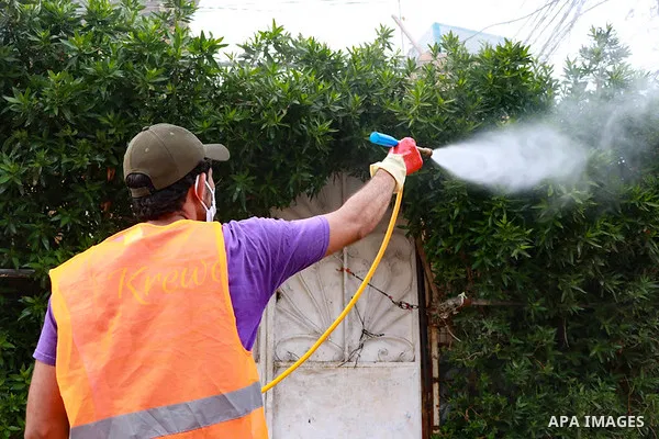 Iraqi worker spray disinfectant as a preventive measure amid fears of the spread of the coronavirus disease (COVID-19), in Baghdad, Iraq, on March 31, 2020. Anas Jomaa