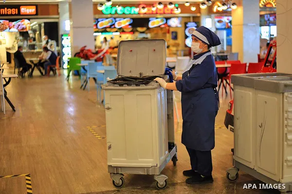 Turks, some wearing masks as a precaution against the spread of the coronavirus disease (COVID-19), sit in cafes, after the decision to open restaurants, cafes, cafeterias and public places in Istanbul, Turkey on June 3,...